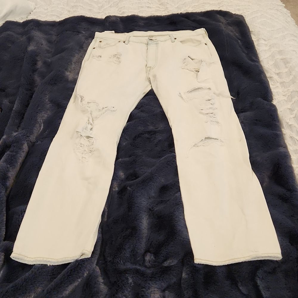 Light wash, extremely distressed button fly Levi's 501 jeans size 36!